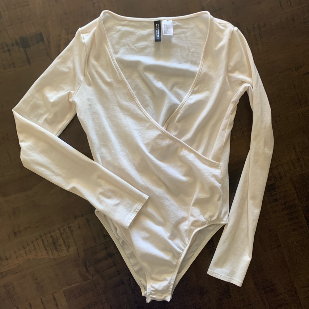 Cream colored body suit